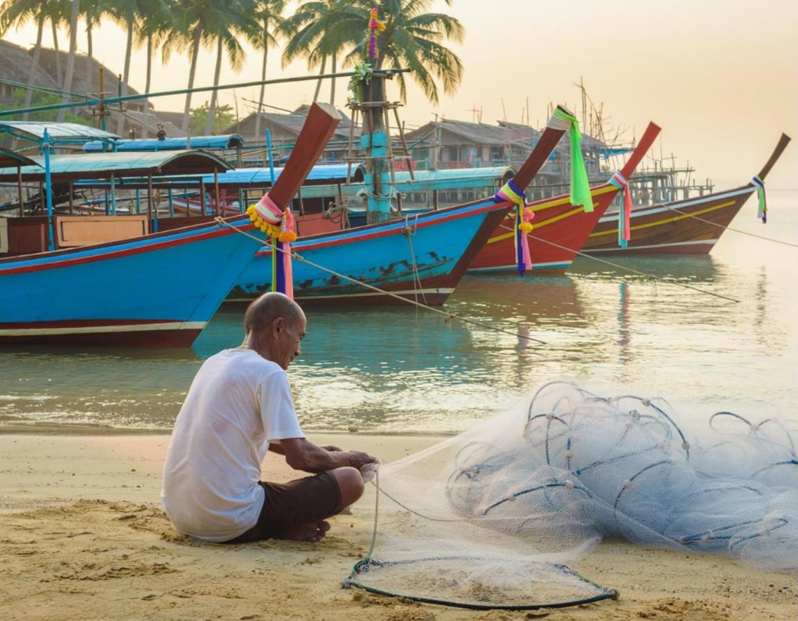 Long-tail boats in a fishing village near Bang Tao, Phuket (illustration)